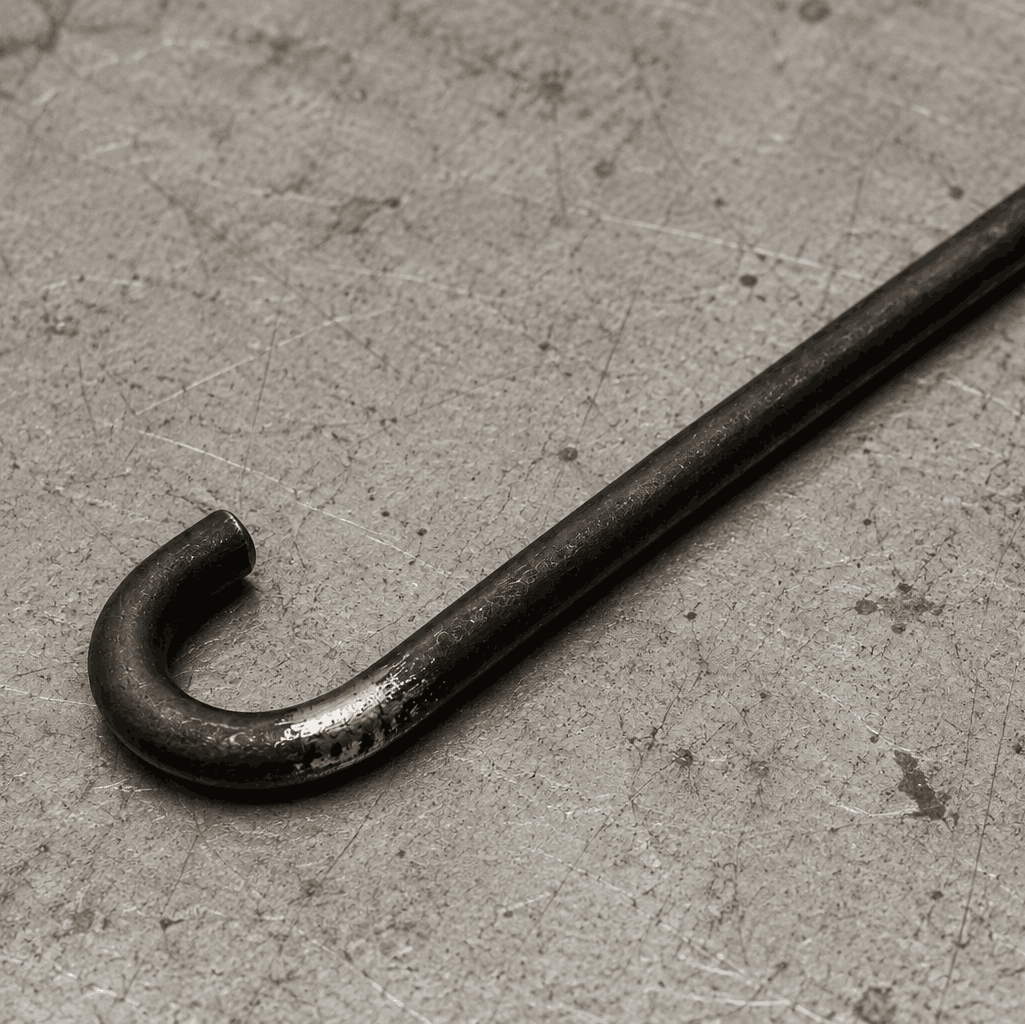 Powder coating hook with a worn contact point from repeated use