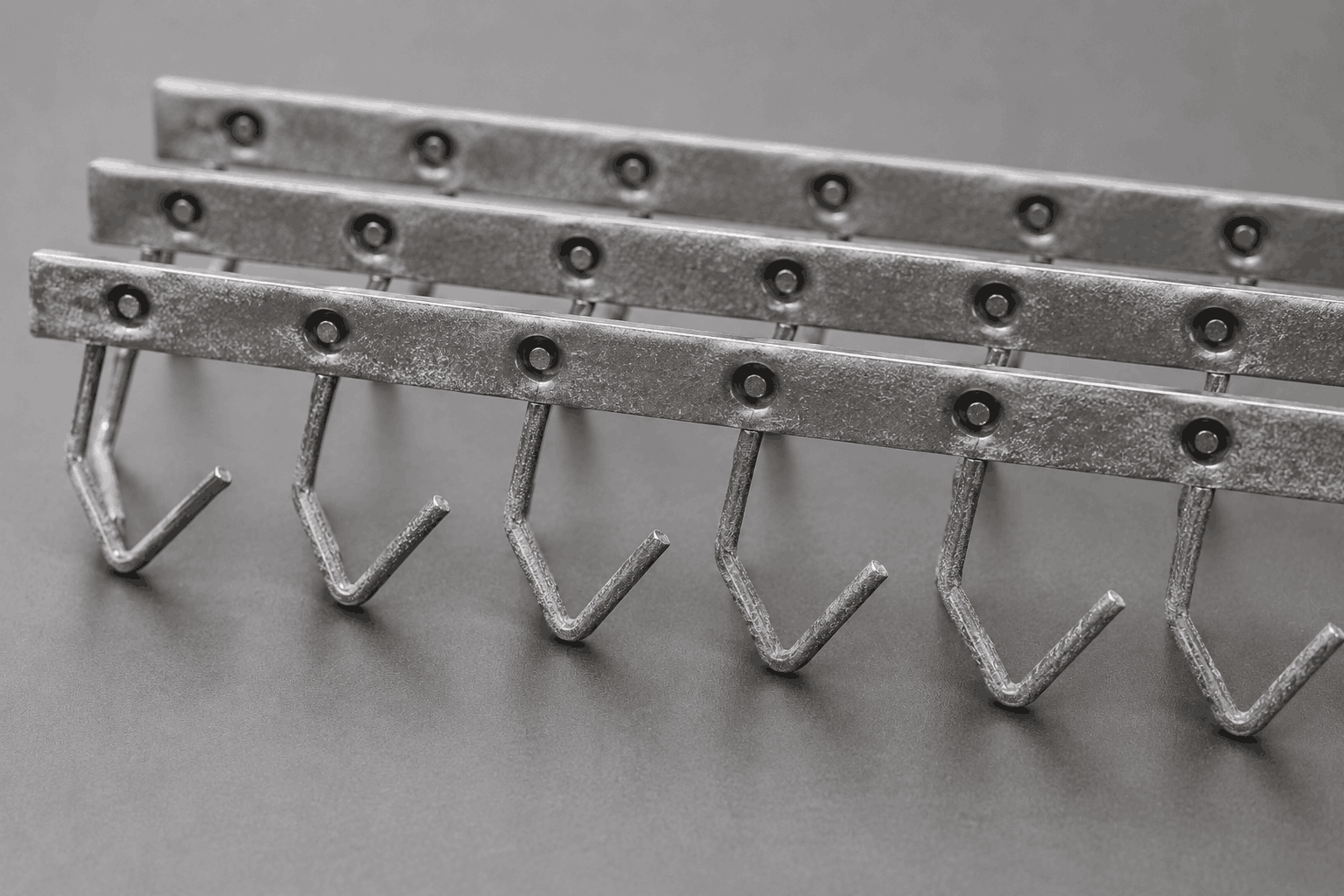 Powder coating hooks with visible coating buildup